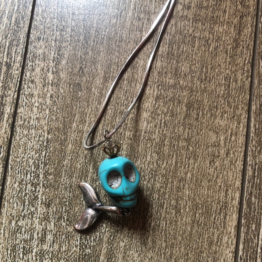 Unique turquoise skeleton sterling silver necklace.